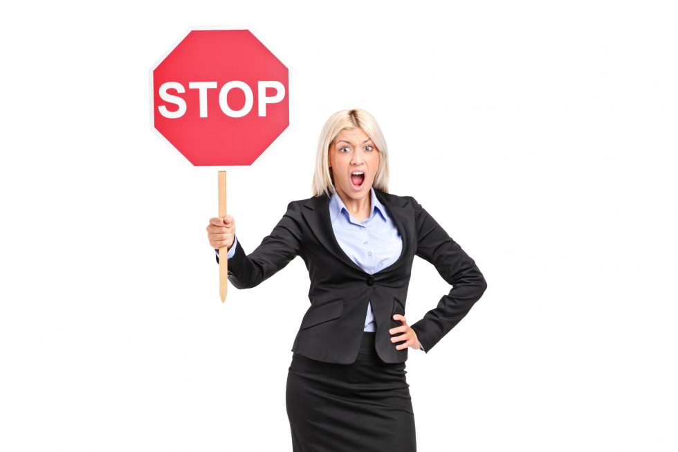 Woman Holding A Road Stop Sign