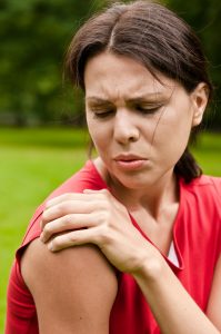 Woman With Pain In Her Shoulder